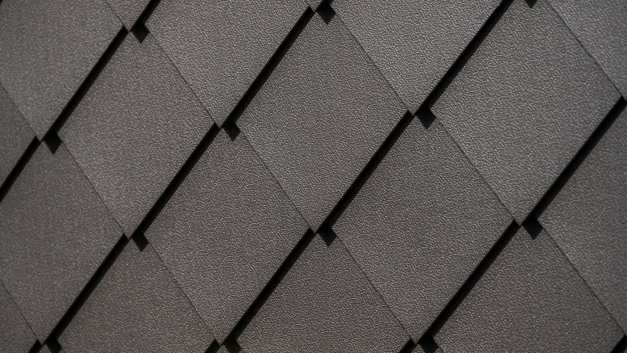 PREFA Wandraute 29 × 29 in Nussbraun Nahaufnahme mit Stucco-Oberfläche