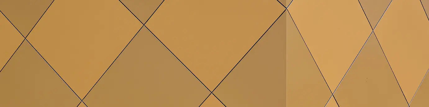 Nahaufnahme einer Ecke des Musikvereins in Zwettl. Es sind die karoförmigen PREFA Aluminium Verbundplatten zu sehen, wie sie um die Ecke des Gebäudes gebogen wurden und dadurch für eine homogene Optik sorgen.